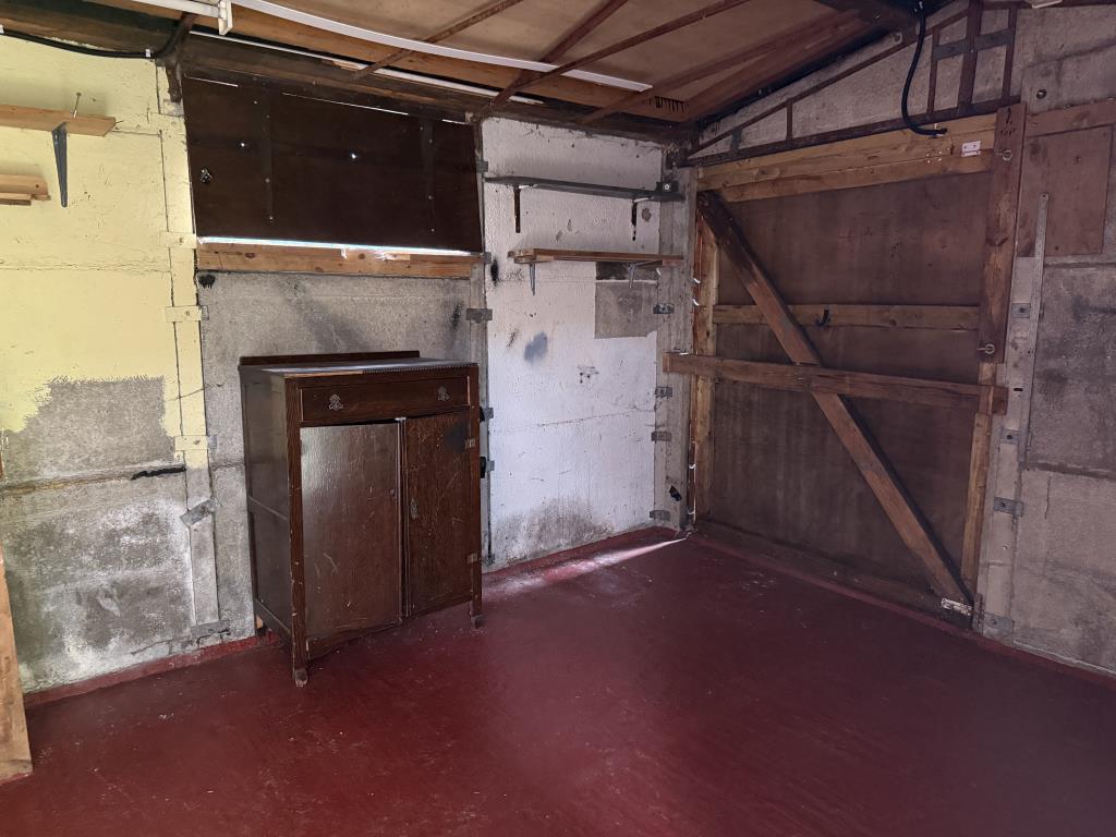 Lot: 142 - ONE-BEDROOM FLAT - View of space within outbuilding